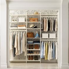 an organized closet with clothes and shoes