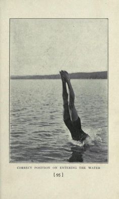 an old black and white photo of a man diving into the water with his hands in the air