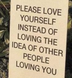 a sign that says, please love yourself instead of loving the idea of other people loving you