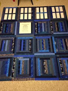 a quilt made with blue and white squares