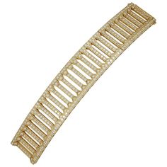 an image of a gold bracelet on a white background with clippings to the side