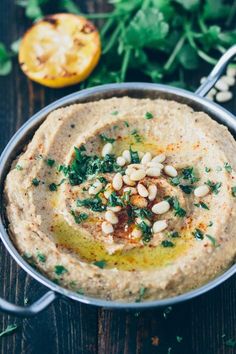 an image of hummus in a pot on the table