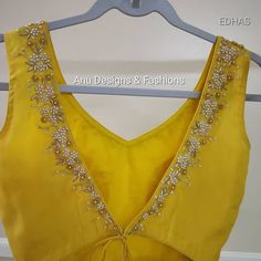 #Blouse #Indian Dress elegant #Saree #Sleeveless #Yellow Sleeveless yellow saree blouse Sleeveless yellow saree blouse Stylish Blouse Design Net, Yellow Saree Blouse, Designer Blouse Patterns Unique, Saree Blouse Sleeveless, Yellow Blouse Designs, Choli Design, Function Dresses, Kundan Work