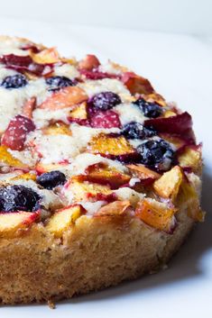 a cake with fruit and cream toppings on it