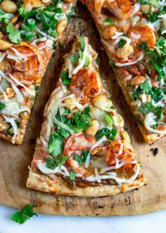 several slices of pizza on a wooden cutting board