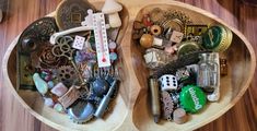 two wooden trays filled with assorted items on top of a wood floor next to each other