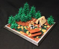 a lego model of a camp site with trees