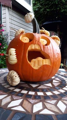 a carved pumpkin with an evil face and teeth