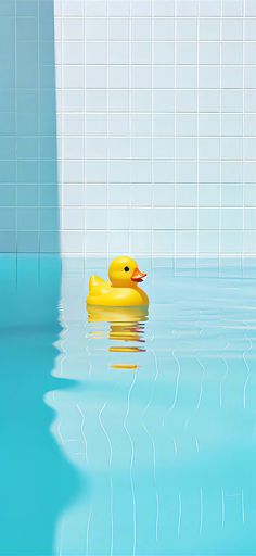 a yellow rubber duck floating on top of a blue swimming pool next to a white tiled wall