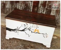 a painted chest with two birds on it