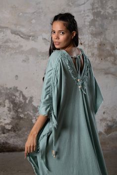 PUSKUL Kaftan embodies the essence of boho-chic, a natural and ethereal dress that effortlessly combines comfort and style. Crafted from the softest cotton available, this dress will envelop your skin like a gentle, warm embrace. PUSKUL Kaftan is versatile and can be worn on any occasion, from the dance floors to formal events, street wear to desert outfits. You can also wear it in two distinct styles: as a kaftan or as a sultry dress, simply by changing the way you put it on! Puskul Kaftan is e Bohemian Tunic For Daywear With Relaxed Fit, Bohemian Tunic With Relaxed Fit For Daywear, Bohemian Cotton Maxi Dress With Natural Dye, Bohemian Flowy Unlined Cover-up, Flowy Bohemian Unlined Cover-up, Bohemian Unlined Beach Dress For Spring, Bohemian Dresses For Gatherings, Unlined Bohemian Beach Dress For Spring, Spring V-neck Dress With Natural Dye