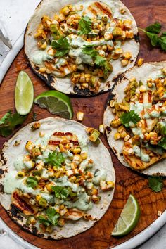 three tortillas topped with corn and cilantro