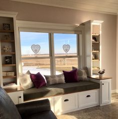 a living room filled with furniture and windows