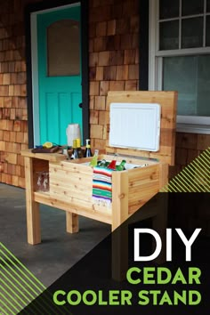 a wooden cooler sitting on top of a porch next to a green door and window