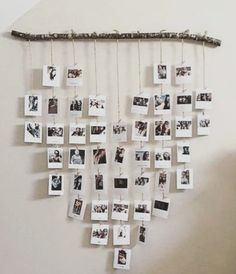 a group of photos hanging on a wall with clothes pins attached to it and pictures pinned to the wall