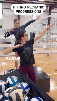 two girls are playing volleyball in an indoor gym with the words hitting mechanic progressions above them