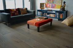 a living room with two couches and a coffee table in front of a window