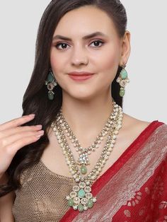 This jewelry set consists of a necklace and a pair of earrings Gold-plated necklace, has white and lime green kundan-studded and detail, and secured with a drawstring closure A pair of matching earrings, each secured with a post and back closure Size & Fit Necklace: 46.5 cm x 6.5 cm(Length x Width) Earring: 46.5 cm x 3 cm(Length x Width) Material & Care Material: Alloy Plated: Gold-Plated Stone type: Kundan Care Instructions Wipe your jewelry with a soft cloth after every use Always store your jewellery in a flat box to avoid accidental scratches Keep sprays and perfumes away from your jewelry Do not soak your jewellery in water Clean your jewelry using a soft brush, dipped in jewelry cleaning solution only Dispatch within 7 days Jewelry Cleaning, Jewelry Cleaning Solution, Stud Jewelry, Dress Jewelry, Gold Plated Necklace, Indian Jewellery, Green Stone, Wedding Wear, Necklace Earring Set