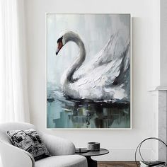 a white swan floating on top of water in a living room