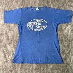 Vintage 80s Bass Pro Shops Fishing Hunting 1980s Fashion Single Stitch Made in USA Blue Graphic T Shirt Medium Mens Condition: Fair Used Condition = Has stains on the front part of the shirt plus on the sleeve due to wear and age. Measurements: Please see photos above for all measurements IF YOU BUY TWO OR MORE ITEMS USE THE CODE BUNDLE @ CHECK TO SAVE 20% WE SHIP WITHIN 24 HOURS AFTER PURCHASE! Please be aware that we do not offer free returns!! The Buyer is responsible for the cost of the retu Blue Short Sleeve T-shirt For Fishing, Vintage Blue Crew Neck Shirt, Blue Graphic, 1980s Fashion, Hunting Fishing, Jay, Favorite Outfit, Bass, Made In Usa