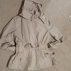 Never Worn. The Hood Unzips, Zipper Detail On Arms, Drawstring Waist, Zipper/Button Closure And Pockets. Nothing Is Wrong W It. I Put It On So You Can See The Fit. I Think It's A Small-Medium. Spring Beige Raincoat With Pockets, Fitted Hooded Windbreaker For Spring, Hooded Windbreaker For Spring Workwear, Spring Workwear Hooded Windbreaker, Fitted Windbreaker With Pockets For Spring, Fitted Long Sleeve Raincoat For Spring, Zipper Detail, Utility Jacket, Lightweight Jacket