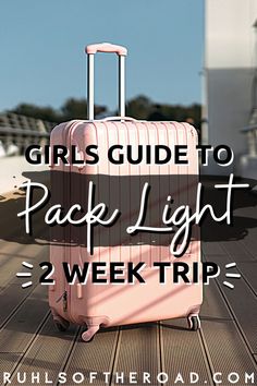 a pink suitcase with the words girls guide to pack light 2 week trip on it