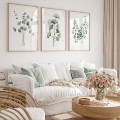 a white living room with wicker furniture and flowers on the coffee table in front of it