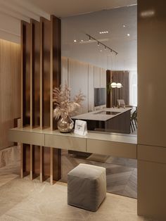 a large mirror in the middle of a room with a bench and stool next to it