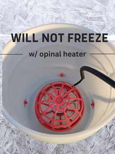 a white bowl with a red object in it and the words will not freeze w / optimal heater