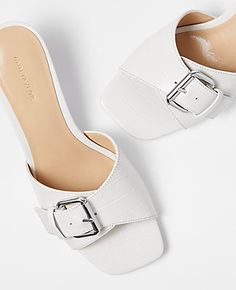 Step out in style and comfort with the Ann Taylor Embossed Buckle Strap Kitten Heel Sandals. These chic sandals are perfect for any fashion-forward woman looking to add a touch of elegance to her wardrobe.

- **Size:** 9 1/2
- **Color:** Winter White
- **Material:** 100% Leather
- **Gender:** Female
- **Heel Height:** 2 inches
- **Features:** Adjustable buckle at front vamp, padded footbed, open toe design

Crafted from premium leather with an embossed buckle strap, these kitten heels offer a se Classic Kitten Heels With Buckle Closure For Spring, Spring Classic Kitten Heels With Buckle Closure, Summer Formal Kitten Heels With Buckle Closure, Kitten Heel Sandals, Chic Sandals, Comfortable Heels, Toe Designs, Winter White, Ann Taylor