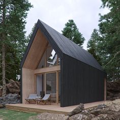 a small black house with a pitched roof