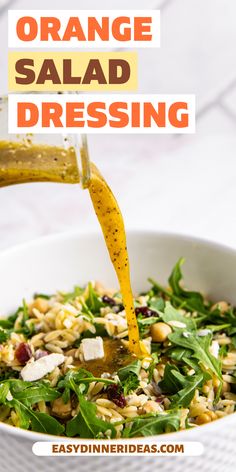 orange salad dressing being poured into a white bowl