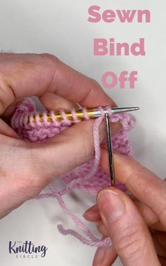 someone crocheting the end of a piece of pink yarn with a knitting needle