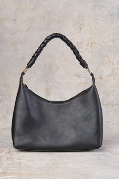 In the world of accessories, oversized plaited details are trending, and our Piper Plait Handle Shoulder Bag is no exception. Fall in love with the soft leather of this slouchy style shoulder bag with its plush microfibre statement handle. In neutral Black, that will pair with any outfit, this fashionable bag will easily take you from day to night. Neutral Handbag, Slouchy Style, Plaits, Leather Trims, Cotton Twill, Fall In Love, Soft Leather, Childrens Clothes, Fashion Bags