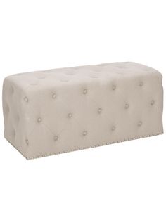 an upholstered bench with buttons on the top and bottom, in white fabric