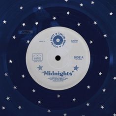 a blue and white record with stars on the side that says midnight's records