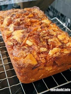 a loaf of bread sitting on top of a cooling rack