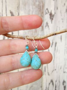 "These pretty turquoise drop earrings will quickly become an everyday favorite. Sterling silver wire wraps around the tops of these howlite briolettes and then dangle from a sterling silver earwire. They measure 1 1/2\" from the top of the earwire. See more earrings in my shop here: https://www.etsy.com/shop/JensBeadBox?section_id=10618715&ref=shopsection_leftnav_5 All my jewelry comes gift boxed with a bow ready for gift giving, whether it is a gift for you or someone special. Thank you for Turquoise Wire Wrapped Teardrop Dangle Earrings, Turquoise Teardrop Drop Earrings, Adjustable Turquoise Teardrop Earrings, Turquoise Teardrop Earrings Wire Wrapped, Turquoise Wire Wrapped Teardrop Earrings, Handmade Turquoise Teardrop Earrings, Turquoise Teardrop Drop Earrings With Ear Wire, Turquoise Teardrop Earrings For Jewelry Making, Bohemian Turquoise Teardrop Drop Earrings