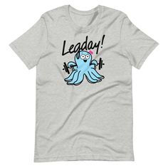 This is just a really cute shirt that you can wear to the gym or out grocery shopping to show your love for leg day! Lifters and non-lifters alike smile when they see this little cartoon octopus with a barbell. This t-shirt feels soft and lightweight, with the right amount of stretch. It's comfortable and flattering for all. • 100% combed and ring-spun cotton (Heather colors contain polyester) • Fabric weight: 4.2 oz/yd² (142 g/m²) • Pre-shrunk fabric • Side-seamed construction • Shoulder-to-sho Sporty Workout T-shirt With Funny Text, Sporty Gym T-shirt With Funny Text, Women Who Workout, Funny Gym Tshirts, Cartoon Octopus, Gym Tshirt, Weightlifting Shirts, Funny Gym, Gym Humor