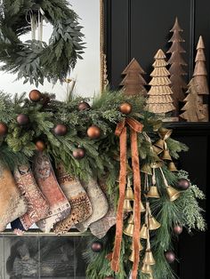 stockings are hung on the mantle with christmas decorations