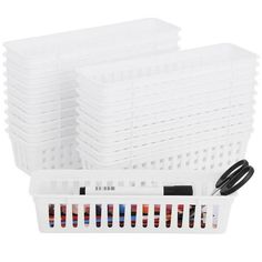 the plastic storage basket is filled with different colored tubes and inks, including one black wire