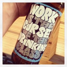 a person holding up a beer bottle with the words work stop and drink class on it