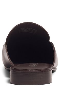 A leather mule topped with a shining metal bit is a timeless silhouette that elevates any refined ensemble with polished detail. Leather upper and lining/rubber sole Imported Classic Slip-on Synthetic Mules, Classic Synthetic Mules For Work, Leather Mules With Suede Lining For Work, Synthetic Mules With Leather Footbed For Work, Elegant Leather Mules With Suede Lining, Classic Synthetic Mules For Office, Classic Brown Mules With Leather Lining, Classic Closed Toe Faux Leather Mules, Classic Faux Leather Slip-on Mules