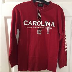 Brand New Officially Licensed University Of South Carolina Long Sleeve T Shirt Red Fan Apparel T-shirt For Fall, Red T-shirt For School Spirit In Fall, Collegiate Long Sleeve Red T-shirt, University Red Crew Neck Top For School Spirit, University Red Long Sleeve Top For Game Day, Red Collegiate Long Sleeve T-shirt, Red School Spirit Tops For Fall, Red Tops With School Spirit For Fall, Red T-shirt For Fall Fan Merchandise