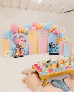 a birthday party setup with balloons and decorations