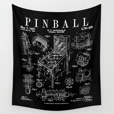 a black and white wall hanging with a drawing of a pinball machine on it