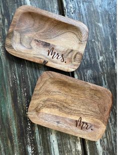 two wooden trays with mr and mrs engraved on them