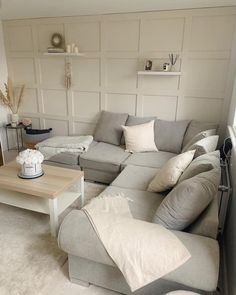 a living room filled with furniture and white walls