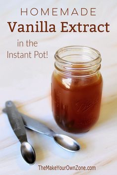 homemade vanilla extrat in the instant pot with spoons and jar next to it