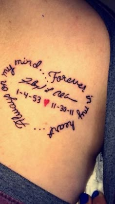 the back of a woman's shoulder with her handwriting on it that says, my mind forever